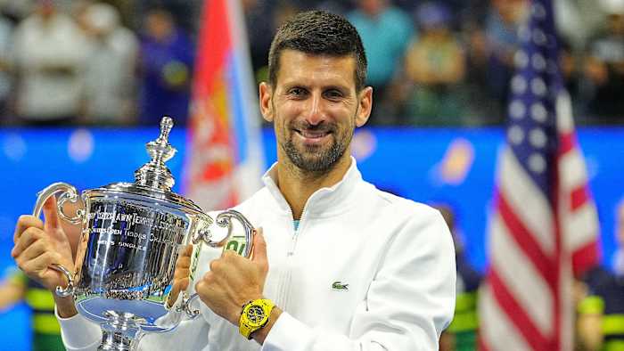 Novak Djokovic poses with the trophy after winning the 2023 U.S. Open.